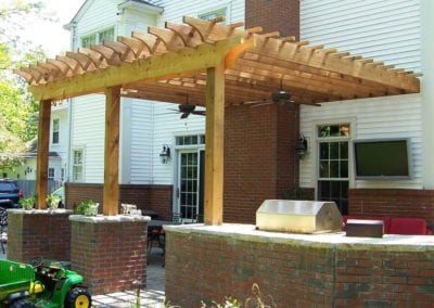wood-pergola-covering-brick-patio