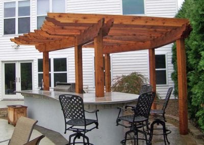 wood-pergola-integrated-into-an-outdoor-bar